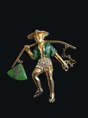 Vintage Gold-Tone Figurine Brooch with Green Enamel Details.